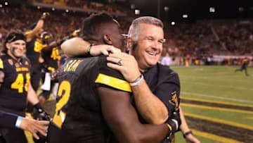 TEMPE, AZ - OCTOBER 14: Head coach Todd Graham of the Arizona State Sun Devils celebrates with linebacker Christian Sam