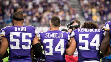 MINNEAPOLIS, MN - OCTOBER 1: Anthony Barr #55, Andrew Sendejo #34, and Eric Kendricks #54 of the Minnesota Vikings join their teammates in linking arms before the game against the Detroit Lions on October 1, 2017 at U.S. Bank Stadium in Minneapolis, Minnesota. (Photo by Stephen Maturen/Getty Images)