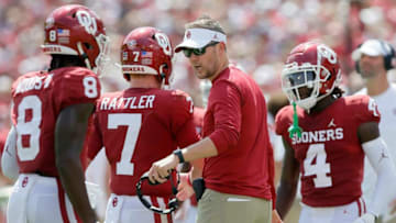 Oklahoma coach Lincoln Riley greets Spencer Rattler (7) and Michael Woods II (8) after an Oklahoma touchdown during a college football game between the University of Oklahoma Sooners (OU) and the Nebraska Cornhuskers at Gaylord Family-Oklahoma Memorial Stadium in Norman, Okla., Saturday, Sept. 18, 2021. Oklahoma won 23-16.Lx16822