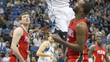 Apr 13, 2016; Minneapolis, MN, USA; Minnesota Timberwolves center Karl-Anthony Towns (32) dunks the ball in the second half against the New Orleans Pelicans at Target Center. The Timberwolves won 144-109. Mandatory Credit: Jesse Johnson-USA TODAY Sports