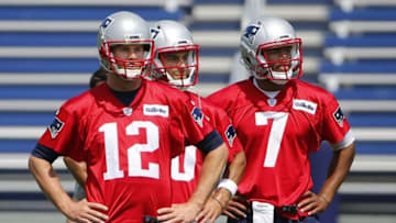 May 26, 2016; Foxborough, MA, USA; New England Patriots quarterback Tom Brady (12), quarterback Jimmy Garoppolo (10) and rookie quarterback Jacoby Brissett (7) look on during OTA