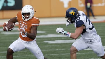 AUSTIN, TX - NOVEMBER 12: Devin Duvernay #2 of the Texas Longhorns runs around Justin Arndt #30 of the West Virginia Mountaineers at Darrell K Royal -Texas Memorial Stadium on November 12, 2016 in Austin. Texas. (Photo by Chris Covatta/Getty Images)