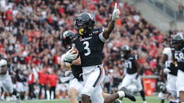 Cincinnati Bearcats safety Ja'von Hicks runs after an interception against the Kennesaw State Owls at Nippert Stadium. Getty Images.