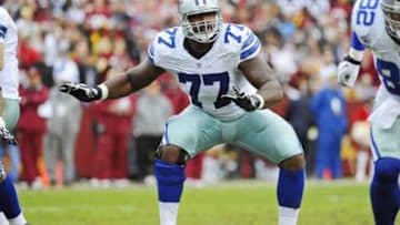 Dec 22, 2013; Landover, MD, USA; Dallas Cowboys offensive tackle Tyron Smith (77) prepares to block against the Washington Redskins during the first half at FedEx Field. Mandatory Credit: Brad Mills-USA TODAY Sports