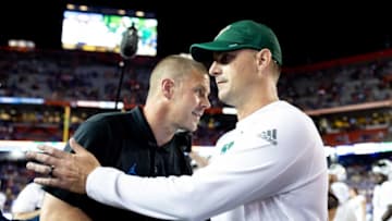 Florida Gators head coach Billy Napier and South Florida Bulls head coach Jeff Scott embrace after the game at Steve Spurrier Field at Ben Hill Griffin Stadium in Gainesville, FL on Saturday, September 17, 2022. [Matt Pendleton/Gainesville Sun]Ncaa Football Florida Gators Vs South Florida Bulls