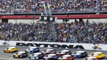 Feb 22, 2015; Daytona Beach, FL, USA; NASCAR Sprint Cup Series drivers go past the start/finish line during the Daytona 500 at Daytona International Speedway. Mandatory Credit: Peter Casey-USA TODAY Sports