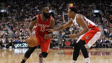 Mar 30, 2015; Toronto, Ontario, CAN; Houston Rockets guard James Harden (13) tries to get around Toronto Raptors guard DeMar DeRozan (10) at the Air Canada Centre. Toronto defeated Houston 99-96. Mandatory Credit: John E. Sokolowski-USA TODAY Sports