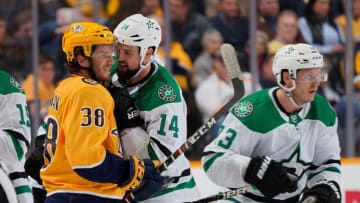 NASHVILLE, TN - FEBRUARY 2: Jamie Benn #14 of the Dallas Stars takes issue with Ryan Hartman #38 of the Nashville Predators at Bridgestone Arena on February 2, 2019 in Nashville, Tennessee. (Photo by John Russell/NHLI via Getty Images)
