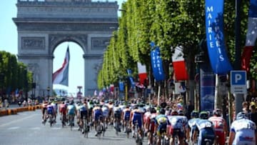 July 22, 2012; Paris, FRANCE; A general view of the peloton as riders make their way up the Champs Elysees towards the Arc de Triomphe during stage twenty of the 2012 Tour de France in Paris. Mandatory Credit: Bernard Papon/Presse Sports via USA TODAY Sports