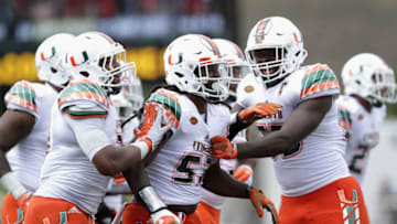 BOONE, NC - SEPTEMBER 17: Mike Smith #57 of the Miami Hurricanes celebrates with teammates after making an interception against the Appalachian State Mountaineers during their game at Kidd Brewer Stadium on September 17, 2016 in Boone, North Carolina. (Photo by Streeter Lecka/Getty Images)