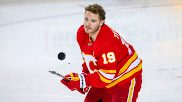 Apr 16, 2022; Calgary, Alberta, CAN; Calgary Flames left wing Matthew Tkachuk (19) controls the puck during the warmup period against the Arizona Coyotes at Scotiabank Saddledome. Mandatory Credit: Sergei Belski-USA TODAY Sports