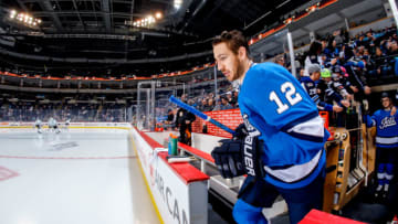 WINNIPEG, MB - MARCH 25: Kevin Hayes #12 of the Winnipeg Jets hits the ice for the pre-game warm up prior to NHL action against the Dallas Stars at the Bell MTS Place on March 25, 2019 in Winnipeg, Manitoba, Canada. (Photo by Darcy Finley/NHLI via Getty Images)