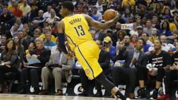 Apr 5, 2015; Indianapolis, IN, USA; Indiana Pacers forward Paul George (13) brings the ball up court against the Miami Heat at Bankers Life Fieldhouse. Mandatory Credit: Brian Spurlock-USA TODAY Sports