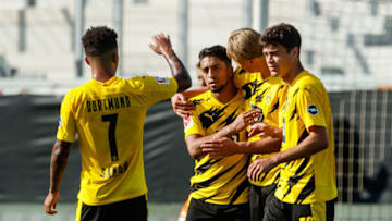 Borussia Dortmund players celebrate a goal (Photo by Roland Krivec/DeFodi Images via Getty Images)