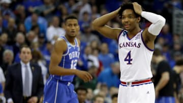 OMAHA, NE - MARCH 25: Devonte' Graham #4 of the Kansas Jayhawks reacts against the Duke Blue Devils during the second half in the 2018 NCAA Men's Basketball Tournament Midwest Regional at CenturyLink Center on March 25, 2018 in Omaha, Nebraska. (Photo by Streeter Lecka/Getty Images)