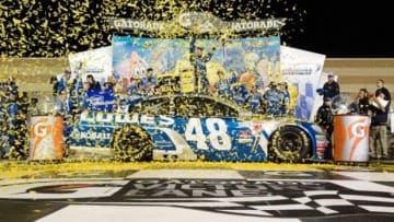 May 9, 2015; Kansas City, KS, USA; NASCAR Sprint Cup Series driver Jimmie Johnson celebrates in Victory Lane after winning the Spongebob Squarepants 400 at Kansas Speedway. Mandatory Credit: Jasen Vinlove-USA TODAY Sports