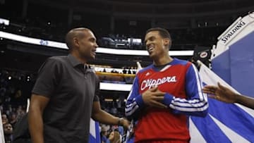Nov 6, 2013; Orlando, FL, USA; American former basketball player Grant Hill (left) talks with Los Angeles Clippers small forward Matt Barnes (22) at the end of the game against the Orlando Magic at Amway Center. Orlando Magic defeated the Los Angeles Clippers 98-90. Mandatory Credit: Kim Klement-USA TODAY Sports