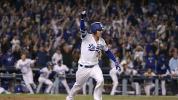 LOS ANGELES, CA - OCTOBER 16: Cody Bellinger #35 of the Los Angeles Dodgers hits a walk-off single for the win in the 13th inning of Game Four of the National League Championship Series against the Milwaukee Brewers at Dodger Stadium on October 16, 2018 in Los Angeles, California.The Dodgers defeated the Brewers 2-1 in extra innings. (Photo by Jeff Gross/Getty Images)