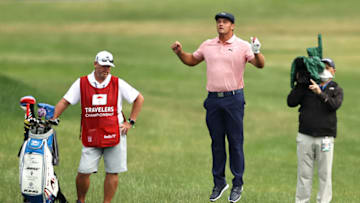 CROMWELL, CONNECTICUT - JUNE 28: Bryson DeChambeau of the United States jumps after playing his shot on the 18th hole during the final round of the Travelers Championship at TPC River Highlands on June 28, 2020 in Cromwell, Connecticut. (Photo by Elsa/Getty Images)