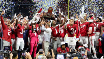 ATLANTA, GEORGIA - DECEMBER 02: The Alabama Crimson Tide celebrate with the SEC Championship trophy after defeating the Georgia Bulldogs 27-24 in the SEC Championship at Mercedes-Benz Stadium on December 02, 2023 in Atlanta, Georgia. (Photo by Kevin C. Cox/Getty Images)