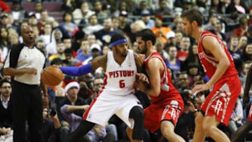 Dec 21, 2013; Auburn Hills, MI, USA; Detroit Pistons small forward Josh Smith (6) defended by the Houston Rockets during the second quarter at The Palace of Auburn Hills. Mandatory Credit: Raj Mehta-USA TODAY Sports