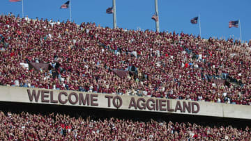 COLLEGE STATION, TX - NOVEMBER 6: Texas A&M University Aggies fans, sometimes referred to as the 12th Man, watch the game against the University of Oklahoma Sooners on November 6, 2004 at Kyle Field in College Station, Texas. The Sooners defeated the Aggies 42-35. (Photo by Ronald Martinez/Getty Images)