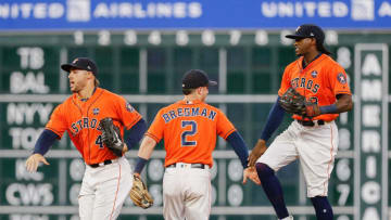 HOUSTON, TX - SEPTEMBER 22: Alex Bregman #2 of the Houston Astros and George Springer #4 and Cameron Maybin #3 celebrate a 3-0 win over the Los Angeles Angels of Anaheim at Minute Maid Park on September 22, 2017 in Houston, Texas. (Photo by Bob Levey/Getty Images)