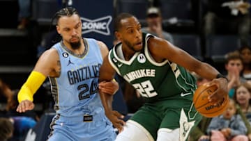 Dec 15, 2022; Memphis, Tennessee, USA; Milwaukee Bucks forward Khris Middleton (22) spins toward the basket as Memphis Grizzlies forward Dillon Brooks (24) defends during the first half at FedExForum. Mandatory Credit: Petre Thomas-USA TODAY Sports