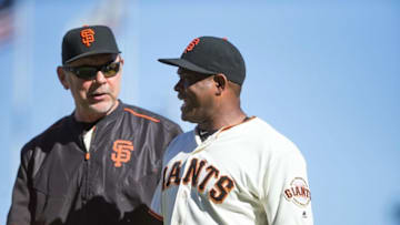 Aug 31, 2016; San Francisco, CA, USA; San Francisco Giants relief pitcher Santiago Casilla (46) smiles with manager Bruce Bochy (15) after the win against the Arizona Diamondbacks at AT&T Park. The San Francisco Giants defeated the Arizona Diamondbacks 4-2. Mandatory Credit: Kelley L Cox-USA TODAY Sports