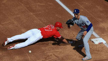 ANAHEIM, CA - JULY 07: Mike Trout #27 of the Los Angeles Angels of Anaheim dives back first base safely on a pick off attempt as Cody Bellinger #35 of the Los Angeles Dodgers defends during the first inning of a game at Angel Stadium on July 7, 2018 in Anaheim, California. (Photo by Sean M. Haffey/Getty Images)