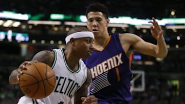 Jan 15, 2016; Boston, MA, USA; Boston Celtics guard Isaiah Thomas (4) moves the ball against Phoenix Suns guard Devin Booker (1) in the second half at TD Garden. The Celtics defeated the Phoenix Suns 117-103. Mandatory Credit: David Butler II-USA TODAY Sports