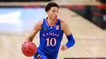 LUBBOCK, TEXAS - DECEMBER 17: Forward Jalen Wilson #10 of the Kansas Jayhawks handles the ball during the first half of the college basketball game against the Texas Tech Red Raiders at United Supermarkets Arena on December 17, 2020 in Lubbock, Texas. (Photo by John E. Moore III/Getty Images)