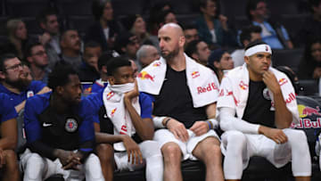 LOS ANGELES, CA - DECEMBER 11: Tobias Harris #34, Marcin Gortat #13, Shai Gilgeous-Alexander #2 and Patrick Beverley #21 of the LA Clippers watch during a 123-99 Toronto Raptors win at Staples Center on December 11, 2018 in Los Angeles, California. NOTE TO USER: User expressly acknowledges and agrees that, by downloading and or using this photograph, User is consenting to the terms and conditions of the Getty Images License Agreement. (Photo by Harry How/Getty Images)