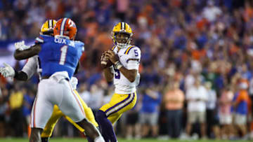 GAINESVILLE, FLORIDA - OCTOBER 15: Jayden Daniels #5 of the LSU Tigers looks to pass during the first half of a game against the Florida Gators at Ben Hill Griffin Stadium on October 15, 2022 in Gainesville, Florida. (Photo by James Gilbert/Getty Images)