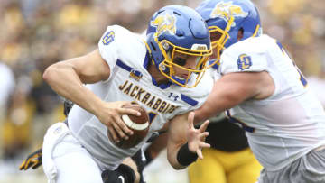 IOWA CITY, IOWA- SEPTEMBER 03: Quarterback Mark Gronowski #11 of the South Dakota State Jackrabbits scrambles on a keeper during the first half against defensive lineman Lukas Van Ness #91 of the Iowa Hawkeyes at Kinnick Stadium on September 03, 2022 in Iowa City, Iowa. (Photo by Matthew Holst/Getty Images)