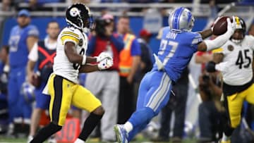 DETROIT, MI - OCTOBER 29: Free safety Glover Quin #27 of the Detroit Lions makes a diving interception against the Pittsburgh Steelers during the first half at Ford Field on October 29, 2017 in Detroit, Michigan. (Photo by Gregory Shamus/Getty Images)