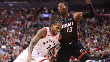 Kawhi Leonard #2 of the Toronto Raptors drives to the basket in the fourth quarter against Bam Adebayo #13 (Photo by Tom Szczerbowski/Getty Images)