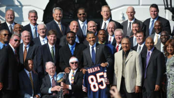 US President Barack Obama poses with members of the Chicago Bears and representatives during an event celebrating 1985 Super Bowl champions, the Chicago Bears, October 7, 2011 on the South Lawn of the White House in Washington, DC. The team's 1986 White House reception to celebrate its Super Bowl victory was cancelled due to the Space Shuttle Challenger crash. AFP PHOTO/Mandel NGAN (Photo credit should read MANDEL NGAN/AFP/Getty Images)