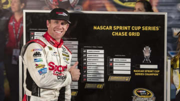 Nov 6, 2016; Fort Worth, TX, USA; Sprint Cup Series driver Carl Edwards (19) places his name on the NASCAR Chase grid after being declared the winner of the AAA Texas 500 at Texas Motor Speedway. Mandatory Credit: Jerome Miron-USA TODAY Sports