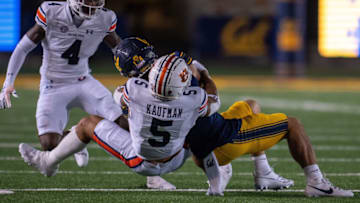 Auburn footballSep 9, 2023; Berkeley, California, USA; California Golden Bears wide receiver Monroe Young (14) is tackled by Auburn Tigers safety Donovan Kaufman (5) during the second quarter at California Memorial Stadium. Mandatory Credit: Neville E. Guard-USA TODAY Sports