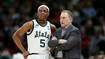 CHICAGO, ILLINOIS - MARCH 16: Cassius Winston #5 of the Michigan State Spartans meets with head coach Tom Izzo in the first half against the Wisconsin Badgers during the semifinals of the Big Ten Basketball Tournament at the United Center on March 16, 2019 in Chicago, Illinois. (Photo by Dylan Buell/Getty Images)