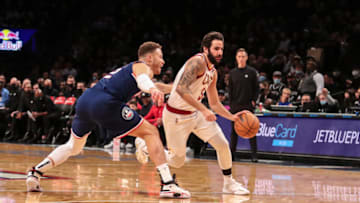 Nov 17, 2021; Brooklyn, New York, USA; Cleveland Cavaliers guard Ricky Rubio (3) drives past Brooklyn Nets forward Blake Griffin (2) in the first quarter at Barclays Center. Mandatory Credit: Wendell Cruz-USA TODAY Sports