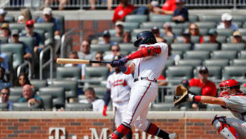 ATLANTA, GEORGIA - SEPTEMBER 19: Ronald Acuna Jr. #13 of the Atlanta Braves hits his 40th homer in the third inning against the Philadelphia Phillies at SunTrust Park on September 19, 2019 in Atlanta, Georgia. (Photo by Kevin C. Cox/Getty Images)