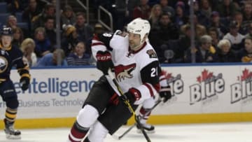 Dec 4, 2015; Buffalo, NY, USA; Arizona Coyotes left wing John Scott (28) looks for the puck during the first period against the Buffalo Sabres at First Niagara Center. Mandatory Credit: Timothy T. Ludwig-USA TODAY Sports