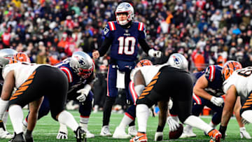 Dec 24, 2022; Foxborough, Massachusetts, USA; New England Patriots quarterback Mac Jones (10) at the line of scrimmage during the second half against the Cincinnati Bengals at Gillette Stadium. Mandatory Credit: Eric Canha-USA TODAY Sports