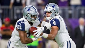Dec 1, 2016; Minneapolis, MN, USA; Dallas Cowboys quarterback Dak Prescott (4) hands the ball off to running back Ezekiel Elliott (21) in the first quarter against the Minnesota Vikings at U.S. Bank Stadium. Mandatory Credit: Brad Rempel-USA TODAY Sports