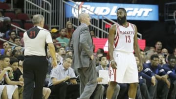 Oct 7, 2015; Houston, TX, USA; Houston Rockets guard James Harden (13) has words for official Scott Wall (31) while Dallas Mavericks head coach Rick Carlisle looks on in the first quarter at Toyota Center. Mandatory Credit: Thomas B. Shea-USA TODAY Sports