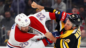 BOSTON, MASSACHUSETTS - FEBRUARY 12: Brad Marchand #63 of the Boston Bruins fights Jeff Petry #26 of the Montreal Canadiens during the first period at TD Garden on February 12, 2020 in Boston, Massachusetts. (Photo by Maddie Meyer/Getty Images)