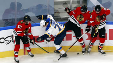 EDMONTON, ALBERTA - JULY 29: Oskar Sundqvist #70 of the St. Louis Blues battles for the puck during the first period against the Chicago Blackhawks in an exhibition game prior to the 2020 NHL Stanley Cup Playoffs at Rogers Place on July 29, 2020 in Edmonton, Alberta. (Photo by Jeff Vinnick/Getty Images)