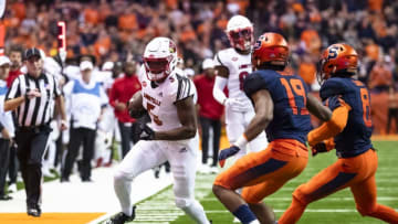SYRACUSE, NY - NOVEMBER 09: Seth Dawkins #5 of the Louisville Cardinals carries the ball for a first down during the second quarter against the Syracuse Orange at the Carrier Dome on November 9, 2018 in Syracuse, New York. (Photo by Brett Carlsen/Getty Images)
